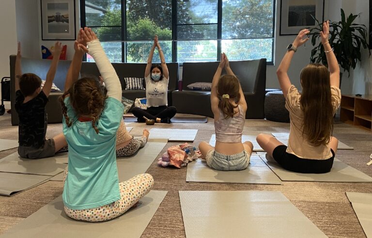 Children enjoying a yoga session as part of family activities at Ronald McDonald House in Westmead