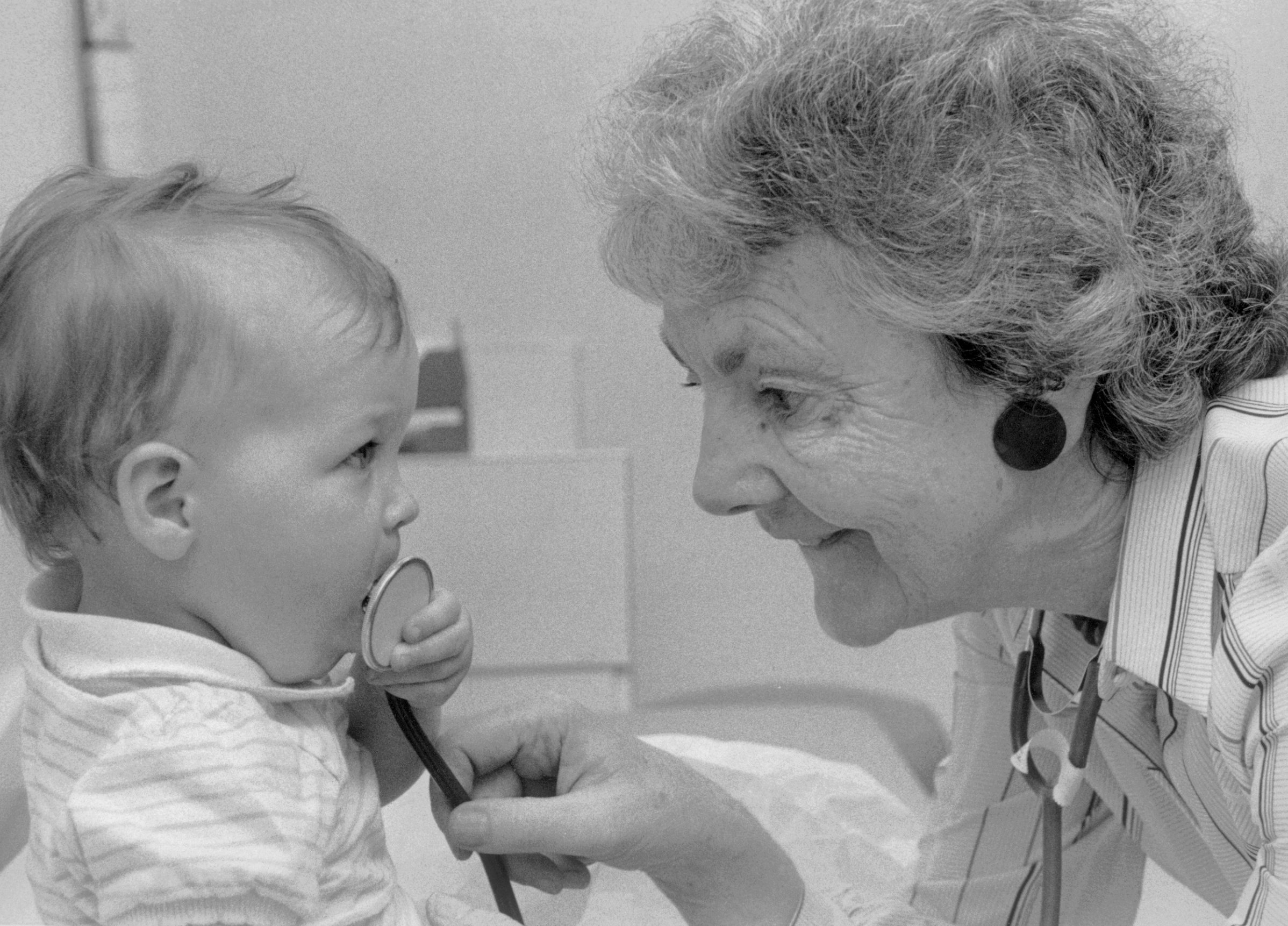 Dr Audrey Evans examining a baby