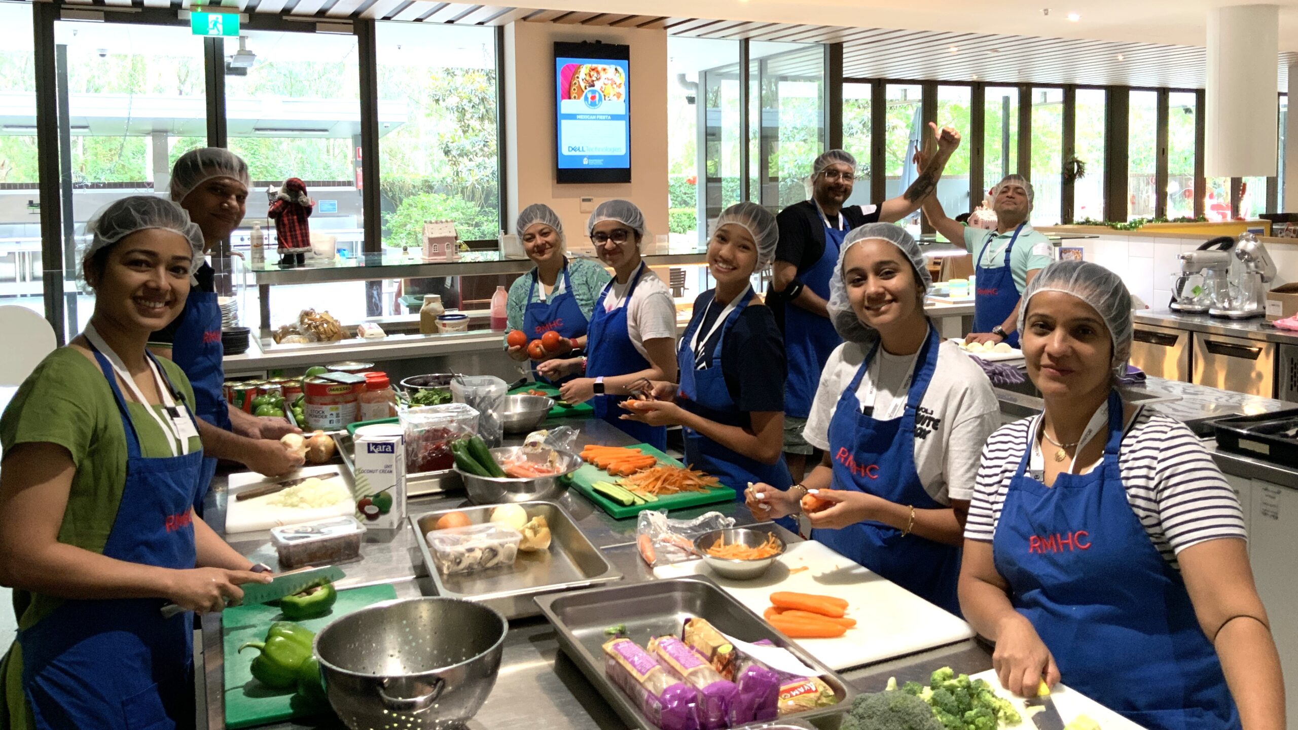 Weekend Cook & Care group volunteering - community group preparing a meal for families of sick kids at Ronald McDonald House in Westmead