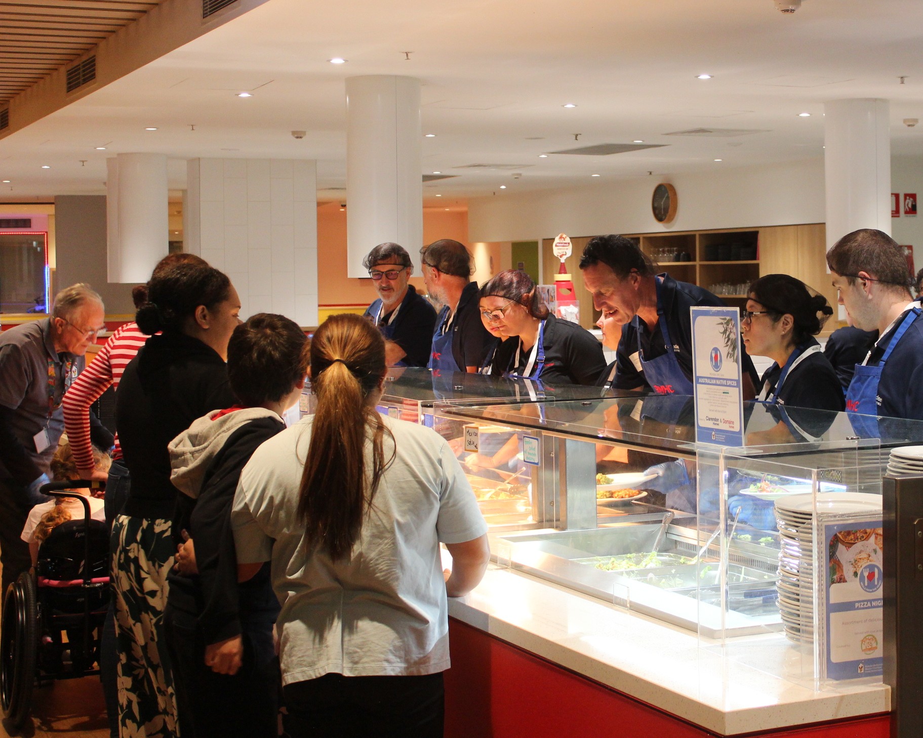 Community group preparing a meal for families of sick kids at Ronald McDonald House in Westmead