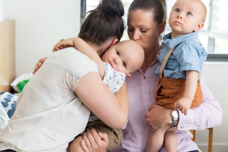 Poignant photo of two mums and their two young sons at Ronald McDonald House in Westmead