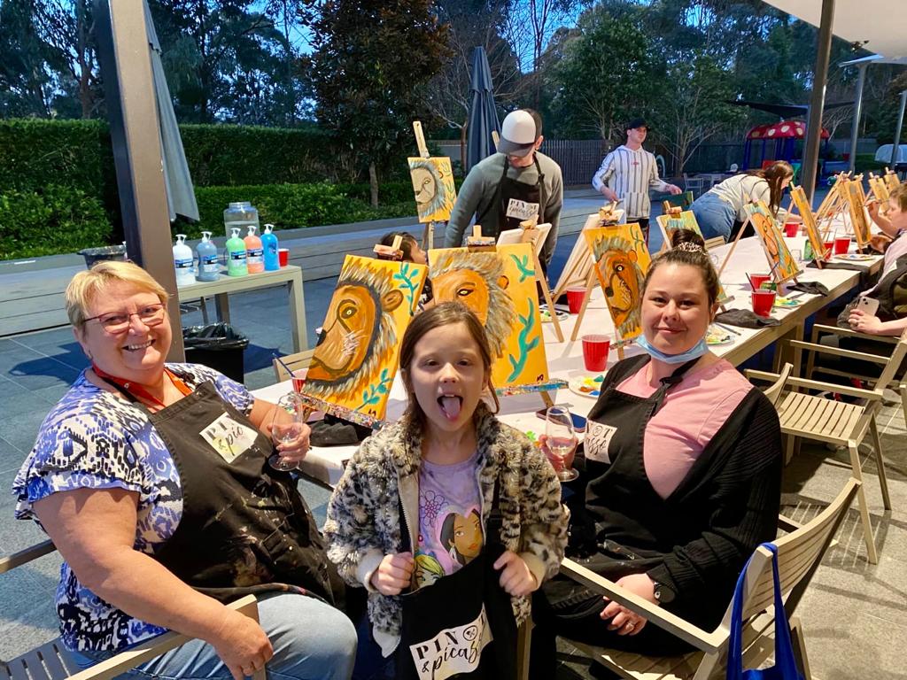 Families enjoying a painting workshop as part of activities planned for families at Ronald McDonald House in Westmead