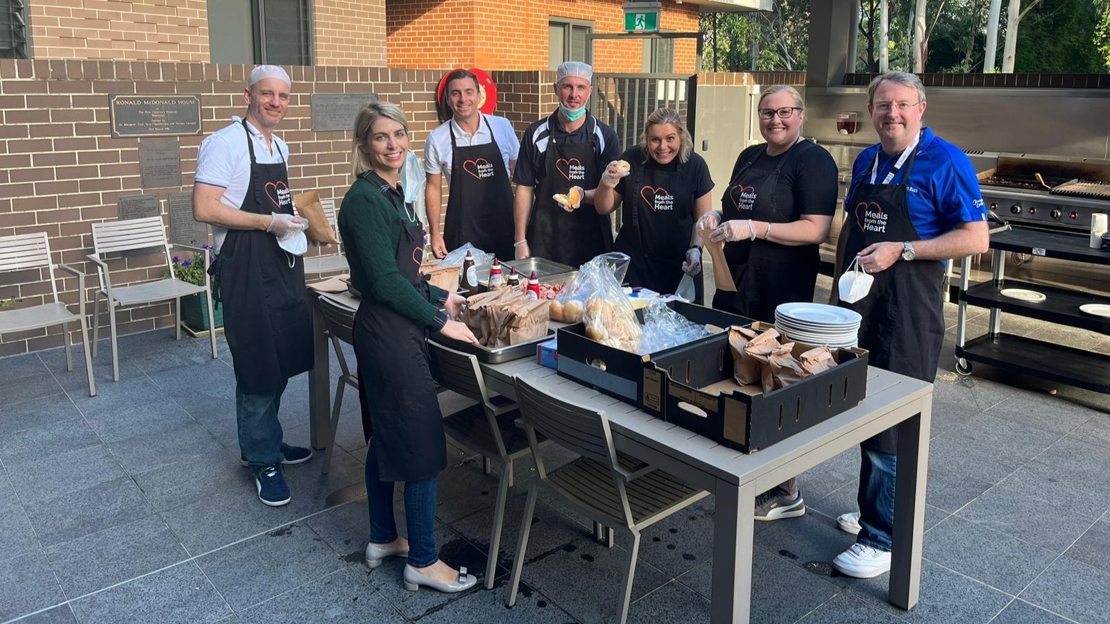 A group of senior leaders and CEOs preparing Rise and Dine breakfast for families at Ronald McDonald House in Westmead as part of CEO Walk in My Shoes