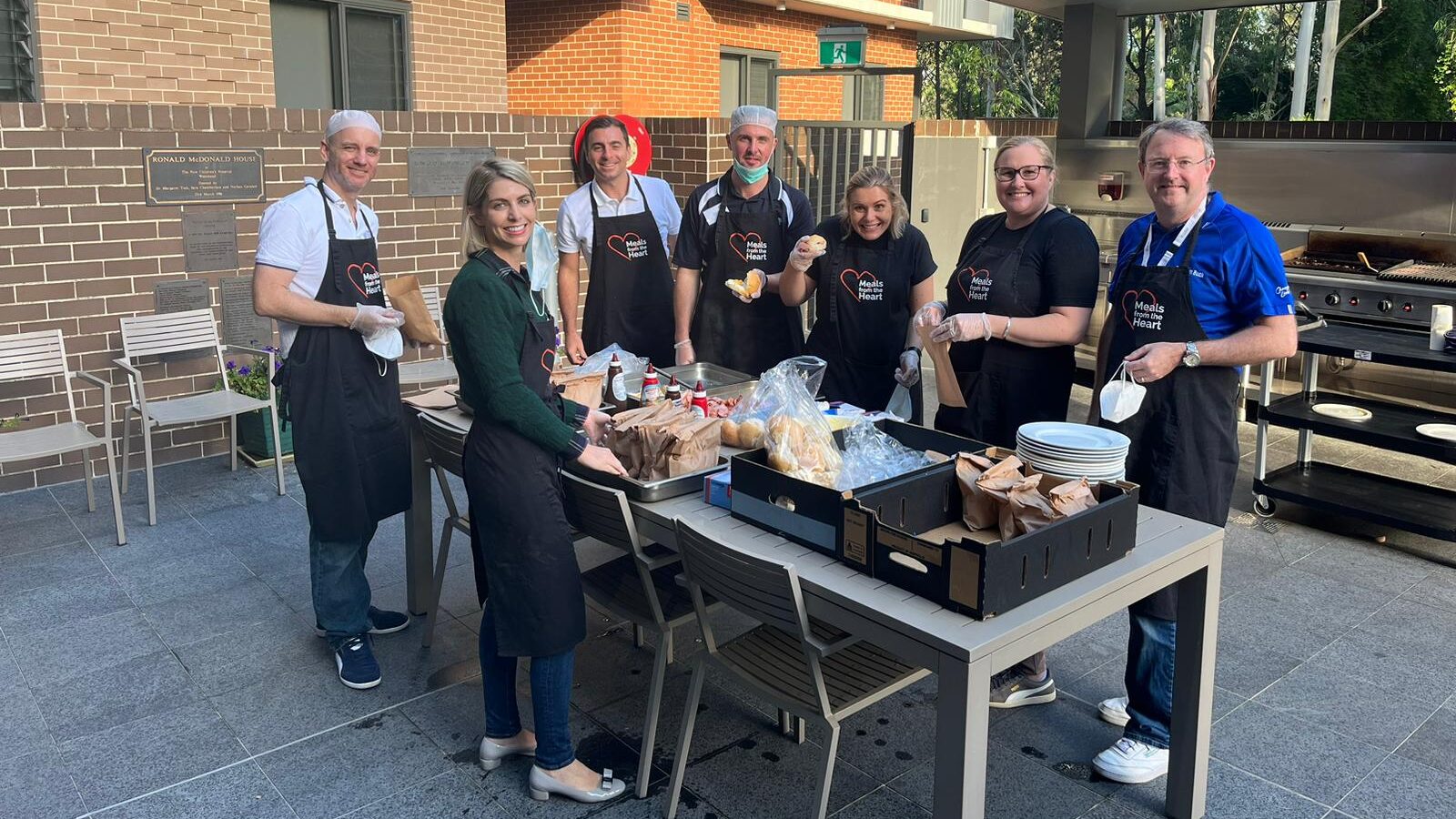 A group of senior leaders and CEOs preparing breakfast for families at Ronald McDonald House in Westmead as part of CEO Walk in My Shoes